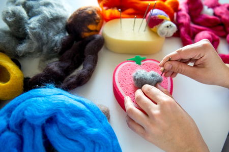 Manufacturing process from wool soft toys. Felting activityの写真素材