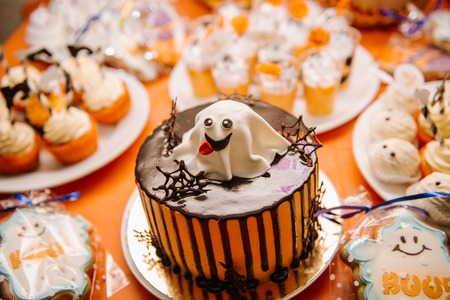 Sweets, treats for the holiday of Halloween.Celebratory Cake with ghost on Halloweenの写真素材