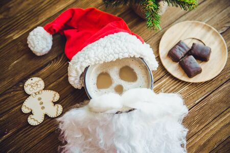 Hot cocoa with marshmallows spices on the old wooden boards.の写真素材