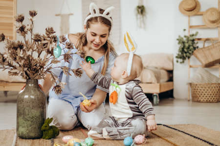 Mother and child get ready to celebrate Easter. Child in Easter Bunny Costume