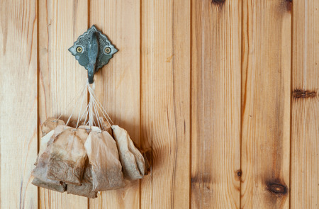 Used tea bags drying on the wallの写真素材