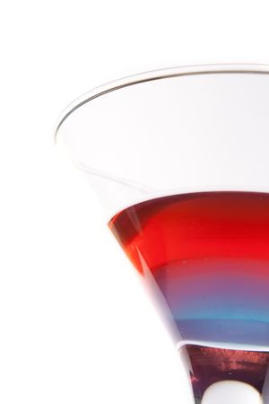 cocktail with blue and red layers isolated on white backgroundの写真素材