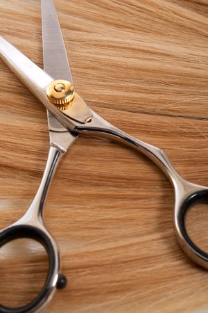 proffesional scissors on lock of hairの写真素材