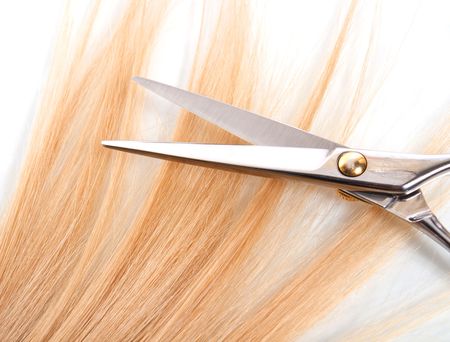 proffesional scissors on lock of hairの写真素材