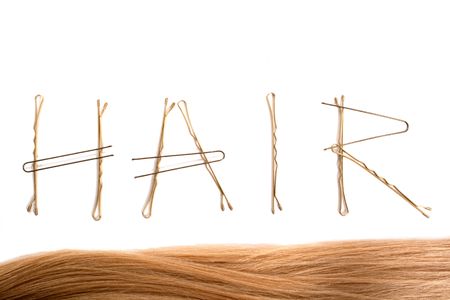 ward hair made from hair slides isolated on whiteの写真素材