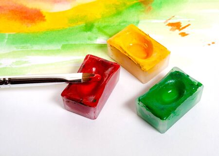 brush and containers with paintの写真素材