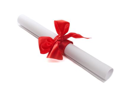 scroll with red  bow isolated on white backgroundの写真素材