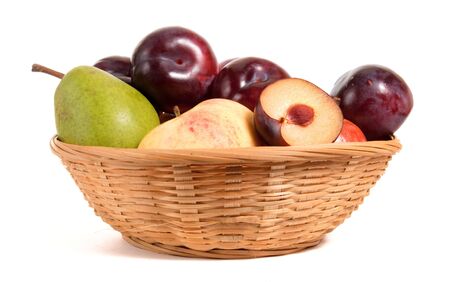 fruits in basket isolated on whiteの写真素材