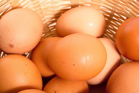 brown eggs in woven basket