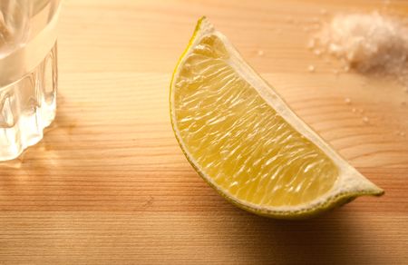 glasses with tequila and slices of limeの写真素材