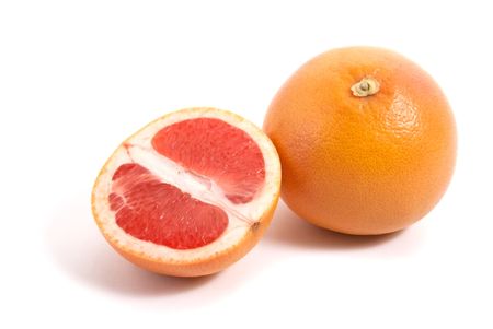 grapefruit with half isolated on white backgroundの写真素材