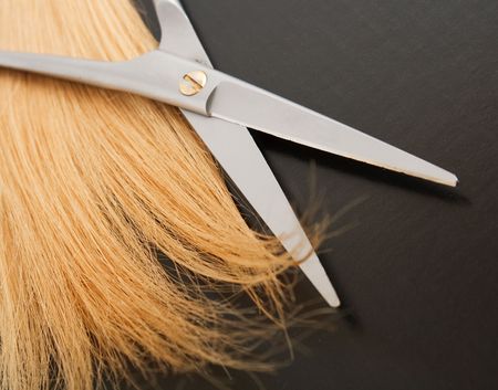 Scissors and lock of hair. selective focusの写真素材