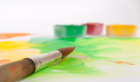 brush and paints on abstract pictureの写真素材