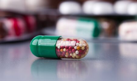 many different pills on grey backgroundの写真素材