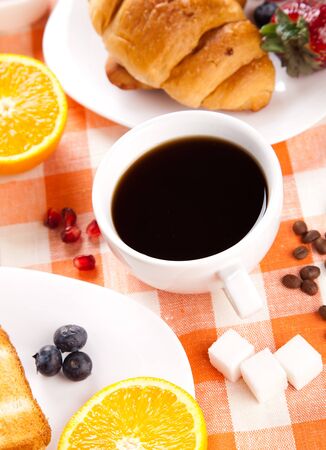 breakfast with toasts jam and fruitsの写真素材