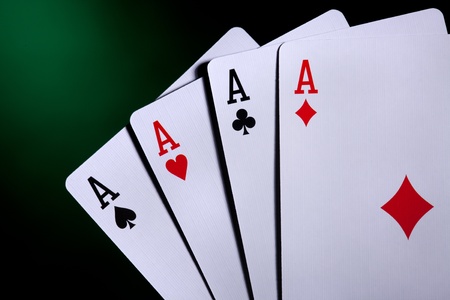 four aces on red background