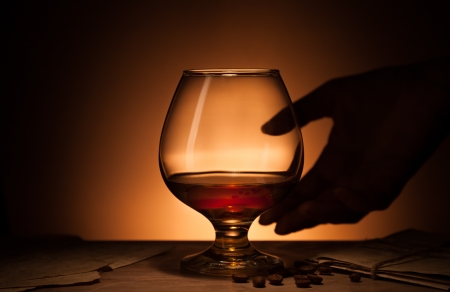 Glass of cognac with old love lettersの写真素材
