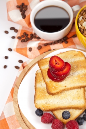 breakfast with toasts coffee and fruitsの写真素材