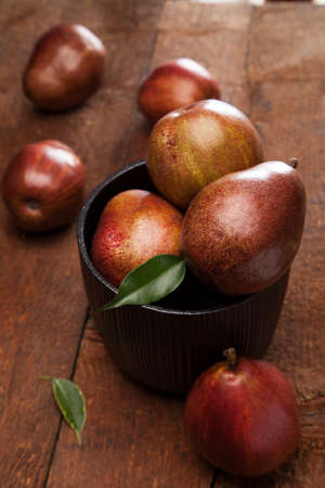 ripe pears on wooden backgroundの写真素材