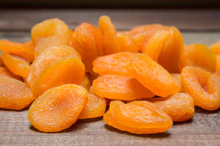 Heap of dried apricots on the tableの写真素材