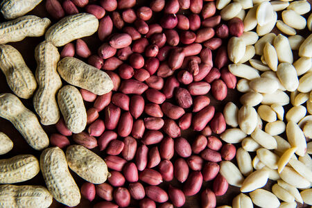 Raw peanuts or arachis on the table