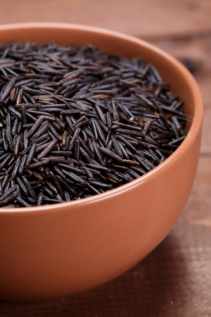 wild rice in a  ceramic bowlの写真素材