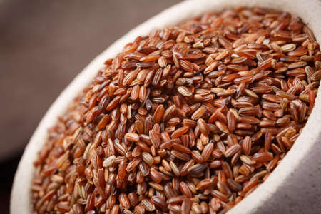 wild red rice in bowlの写真素材