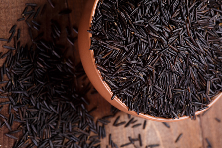 wild rice in a  ceramic bowlの写真素材