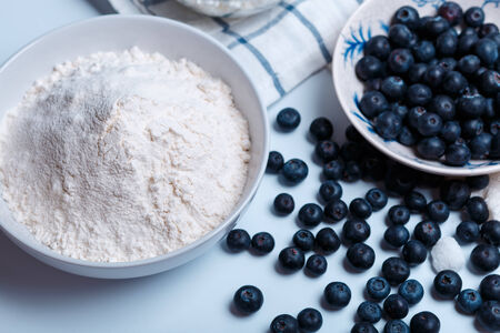 ingredients for cake - meal, eggs, blacberry, sugar and otherの写真素材