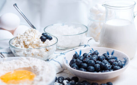 ingredients for cake - meal, eggs, blacberry, sugar and otherの写真素材