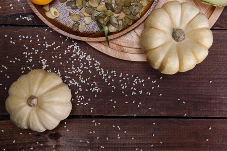 Composition with raw vegetables and spices pumpkins and yellow tomatoesの写真素材