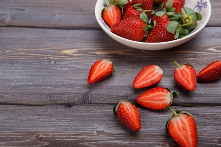 ripe strawberries on a wooden backgroundの写真素材