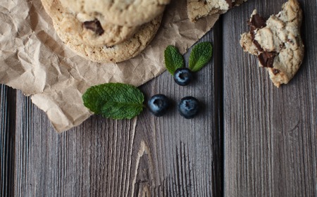 ripe blackberry with leaves of mint and cookies on a wooden backgroundの写真素材
