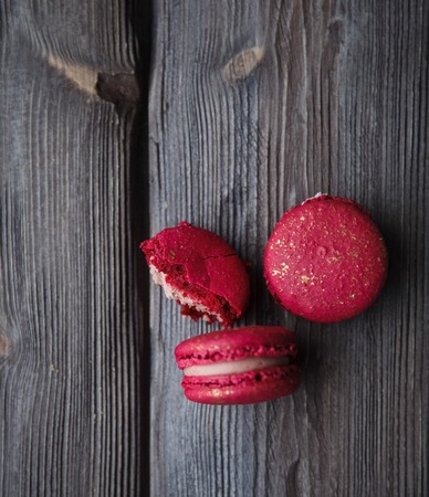 fresh macaroons and ripe blackberry on a wooden backgroundの写真素材