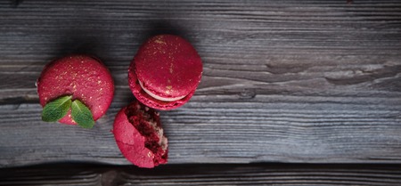 fresh macaroons and ripe blackberry on a wooden backgroundの写真素材