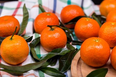 brunch of tangerines on a linen towelの写真素材