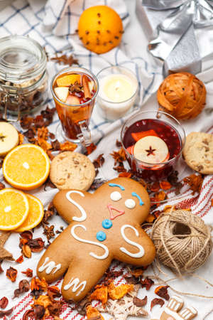 giant gingerbread among pieces of fruits and spicesの写真素材