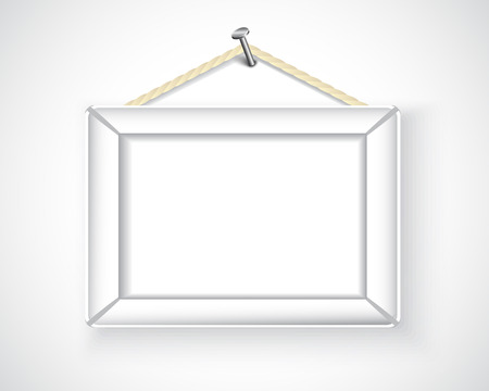 white picture frame hanging on the wallのイラスト素材