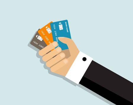 Hand holding three credit cards for paymentのイラスト素材