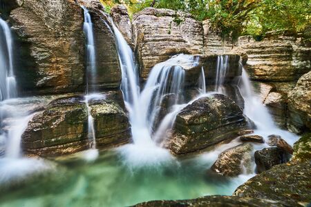 Waterfall mountain stream river in the forest. In Okatse Canyon near Kinchkha Waterfall in Georgia.の写真素材