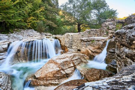 Waterfalls of mountain river in Okatse Canyon near Kinchkha Waterfall in Georgia.の写真素材