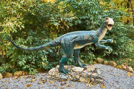 Big model of prehistoric dinosaur Heterodontosaurus in nature. Realistic scene.の写真素材