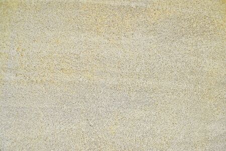 Pale yellow texture of concrete and cement plastered wall.の写真素材