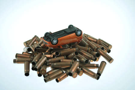 Toy car and bulletsの写真素材