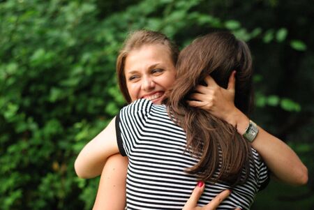 Girls embracingの写真素材