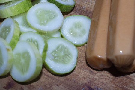 Cucumber on chopping boardの写真素材