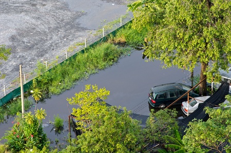 BANGKOK, THAILAND-NOVEMBER 9: Car drowned in a flooded street during the worst flooding in decades on November 9, 2011  Nuan Chan Road, bangkok, Thailand.のeditorial素材
