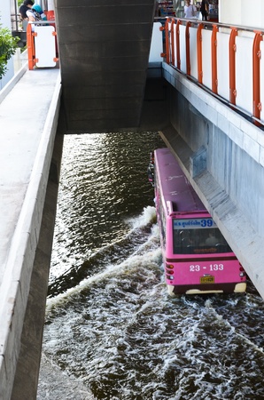 BANGKOK, THAILAND-NOVEMBER 12: Transportation of people in the streets flooded after the heaviest monsoon rain in 20 years in the capital on  November 12, 2011 Phahon Yothin Road, bangkok, Thailand.のeditorial素材