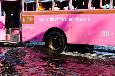BANGKOK, THAILAND-NOVEMBER 12: Transportation of people in the streets flooded after the heaviest...