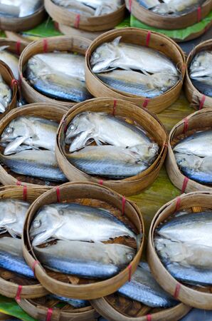 Mackerel fish in bamboo basket at market, Thailand
